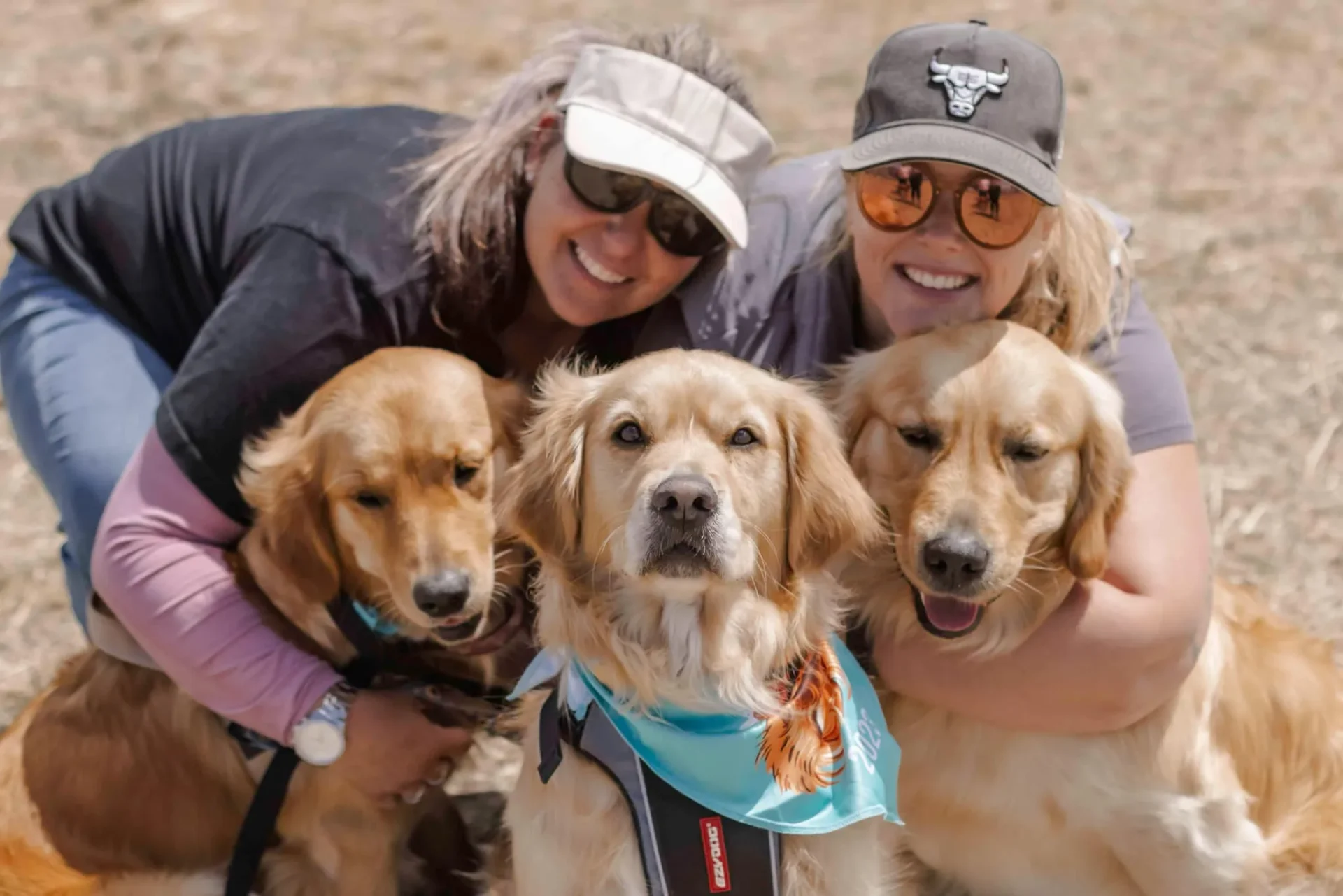 two women with three golden retrievers at Melbourne Gold Rush 2023
